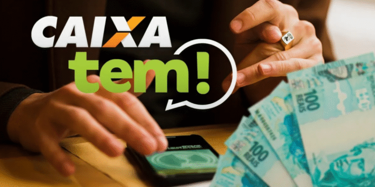 PIX de R$ 200 do Caixa Tem: qual a principal regra para receber? 1 Imagem promocional do app Caixa Tem mostrando mão apontando para celular com o aplicativo aberto, envelope e notas de 100 reais ao lado, destacando transferências via PIX.